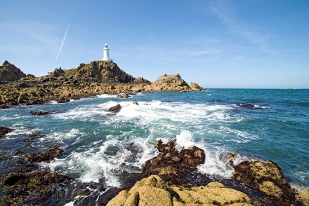 Corbiere Lighthouse and the rocky coast in Jersey, The Channel Islands